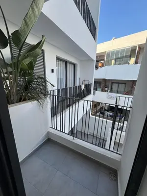 a balcony with a staircase and a plant at Appartement Casablanca in Casablanca