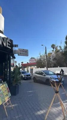 a store with cars parked in a parking lot at Appartement Casablanca in Casablanca