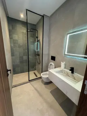 a bathroom with a shower and a sink and a toilet at Appartement Casablanca in Casablanca