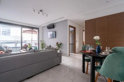 a living room with a couch and a table at Appartement de haut standing au centre ville in Casablanca