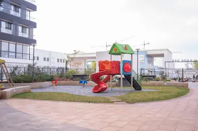 a playground with a slide in front of a building at Appartement de haut standing au centre ville in Casablanca