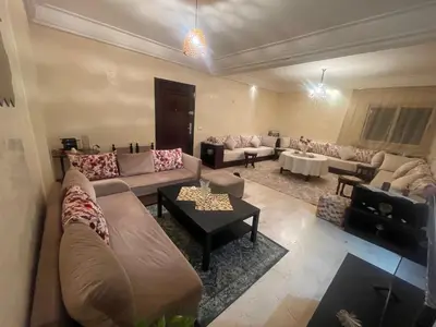 a large living room with couches and a table at Avenue cimetière bourgogne Casablanca in Casablanca