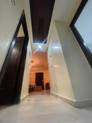 a hallway in a building with a ceiling with lights at Avenue cimetière bourgogne Casablanca in Casablanca