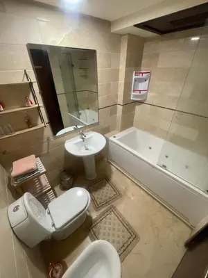 a bathroom with a toilet and a sink and a tub at Avenue cimetière bourgogne Casablanca in Casablanca