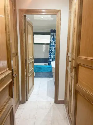 a hallway with an open door to a room at Residence kheir in Casablanca