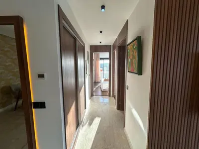 a hallway leading to a room with at Appartement luxueux 2 Chambres avec salle de sport et parking in Casablanca