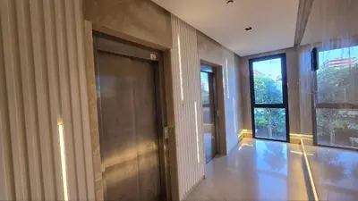 a hallway with a door and windows in a building at aeria mall studio en plein casa in Casablanca