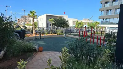 a park with a playground in a city at aeria mall studio en plein casa in Casablanca