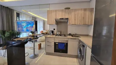a kitchen with a sink and a stove top oven at aeria mall studio en plein casa in Casablanca