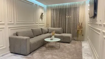 a living room with a couch and a table at Suite luxueuse proche de Cheikh Zayed & CFC in Casablanca