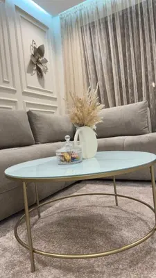 a coffee table in a living room with a couch at Suite luxueuse proche de Cheikh Zayed & CFC in Casablanca