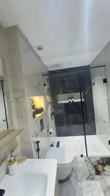 a bathroom with a sink and a toilet at Suite luxueuse proche de Cheikh Zayed & CFC in Casablanca