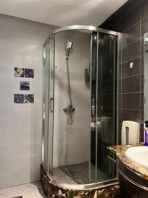 a shower in a bathroom with a sink at Appartement centre de casablanca in Casablanca