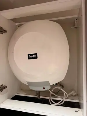 a white toilet in a bathroom with a sign on it at Studio de luxe in Casablanca