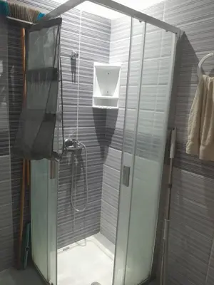 a shower stall with a shower head in a bathroom at Dahomy bouzni9a in Bouznika