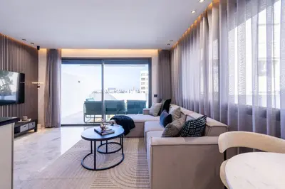 a living room with a couch and a table at Premium Stay - Promenade Hassan II in Casablanca