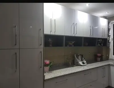 a kitchen with white cabinets and a counter top at Rabat prestigia hayriad in Rabat