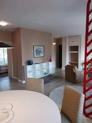 a living room with a table and chairs at Spacious Apartment In CIL Casablanca in Casablanca
