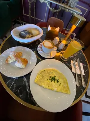 a table with plates of breakfast food on it at Atlantic Suite View 4 in Casablanca