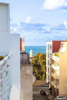 a view of the ocean from the balcony of a building at Prestige Penthouse Style and Serenity Rabat by MERAT HOME in Rabat