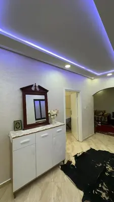 a room with a mirror on top of a counter at Spacious apartment in Settat