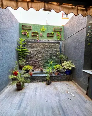 a room with potted plants on a wall at Élégance et Sérénité au Cœur de Casablanca in Casablanca