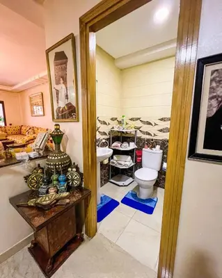 a bathroom with a toilet and a sink at Élégance et Sérénité au Cœur de Casablanca in Casablanca