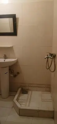 a bathroom with a sink and a mirror and a shower at budget holidays room in Casablanca