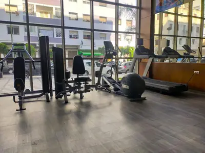 a gym with treadmills and cardio equipment in a building at Joli appartement au centre-ville de Rabat in Rabat