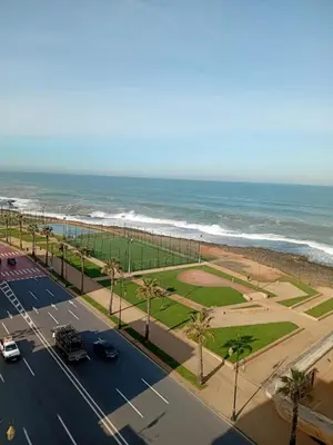 a view of the ocean from the balcony of a condo at Joumaira appartement Beach in Rabat