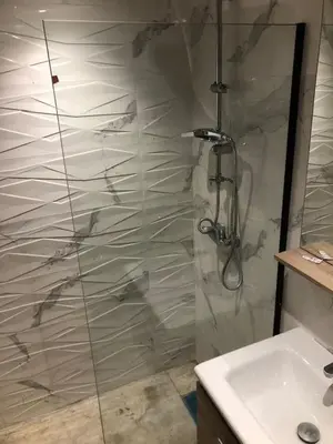 a bathroom with a shower and a sink at Abbogroup Appartement 2 in Casablanca