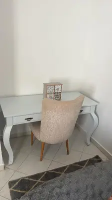 a desk with a chair and a white desk at Jannat tamaris in Tamaris