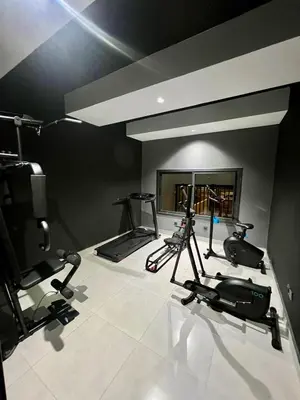 a gym with several exercise bikes in a room at Urban Chic Suite Casablanca city centre - Parking Gym in Casablanca