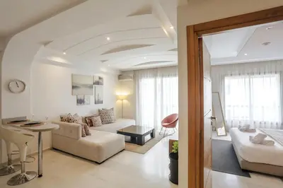 a living room with a couch and a table at Résidence Eden - Maarif in Casablanca