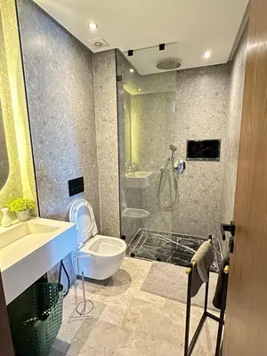 a bathroom with a shower and a toilet and a sink at Studio Usio in Casablanca