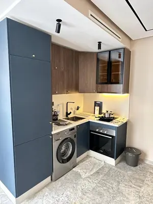 a kitchen with a washing machine and a washer at Studio Usio in Casablanca