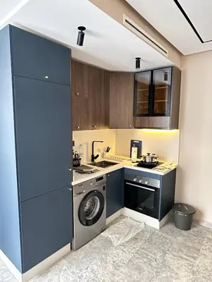 a kitchen with a washing machine and a washer at Studio Usio in Casablanca