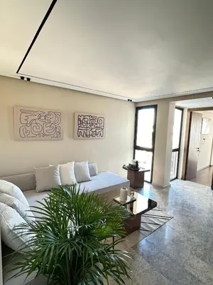 a living room with a couch and a table at Studio Usio in Casablanca
