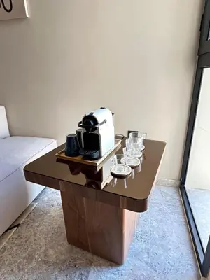 a coffee table with glasses and a toaster on it at Studio Usio in Casablanca