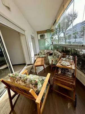 a room with couches and tables in a building at Peninsula Dar Bouazza in Tamaris