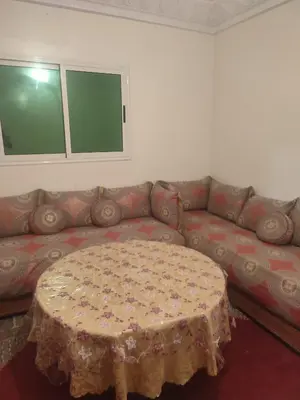 a living room with a couch and a table at Big family house sohofi in Casablanca