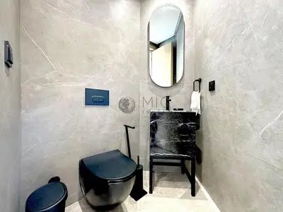a bathroom with a sink and a toilet and a mirror at TheBesty Ocean Suite -By Appart'Ayla in Anfa-Supérieur