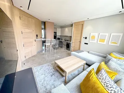 a living room with a couch and a table at TheBesty Ocean Suite -By Appart'Ayla in Anfa-Supérieur