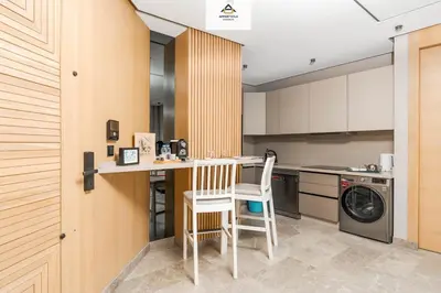 a kitchen with a counter and a washing machine at TheBesty Ocean Suite -By Appart'Ayla in Anfa-Supérieur