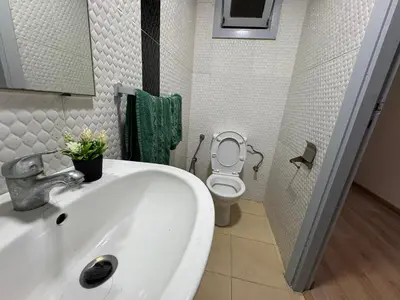 a bathroom with a white sink and a toilet at super studio vue sur mer pour les familles in Rabat