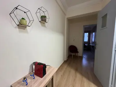 a room with a table and some plants on the wall at super studio vue sur mer pour les familles in Rabat