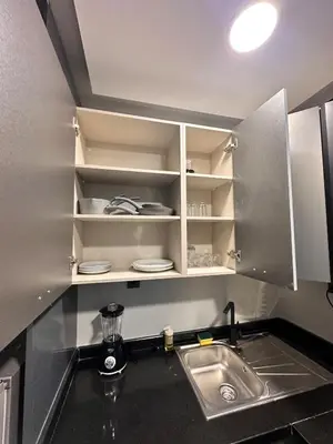 a kitchen with a sink and a counter top at familyconfort casa evasion in Casablanca