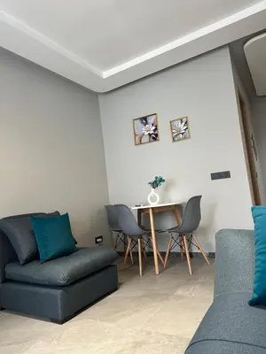 a living room with a couch and a table at familyconfort casa evasion in Casablanca