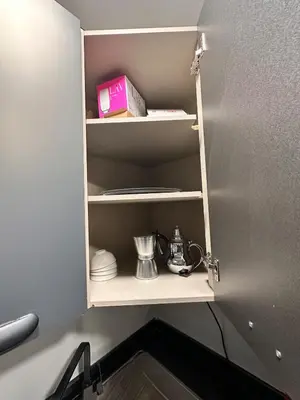 a cupboard in a kitchen with a shelf at familyconfort casa evasion in Casablanca