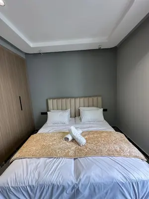 a bedroom with a bed with a phone on it at familyconfort casa evasion in Casablanca